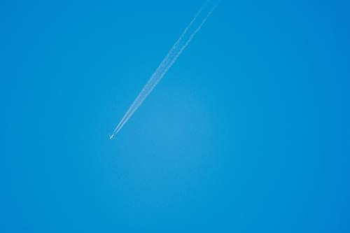 flare low-angle photography of plane light