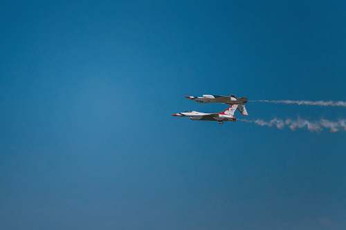 airplane low-angle photography of two white-and-blue aircraft orlando melbourne international airport