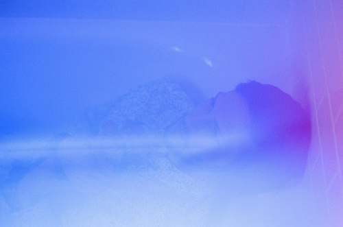 nature man in grey shirt lying on bathtub outdoors