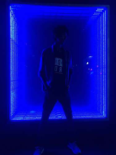person man standing in front of light human