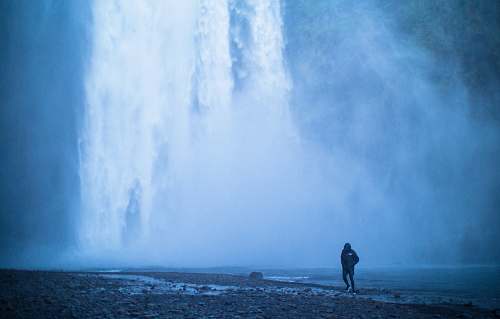 nature man walking at the seashore water