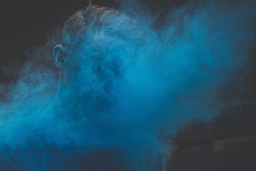 smoke man's face covered with smoke person