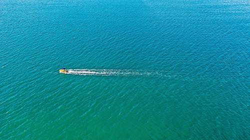 nature motorboat sailing on sea during daytime ocean