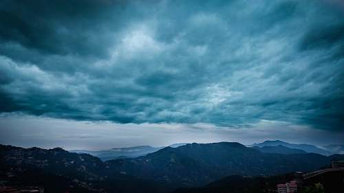 cloud mountains under gray clouds sky