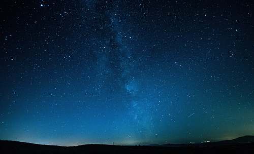 astronomy mountains under starry sky galaxy