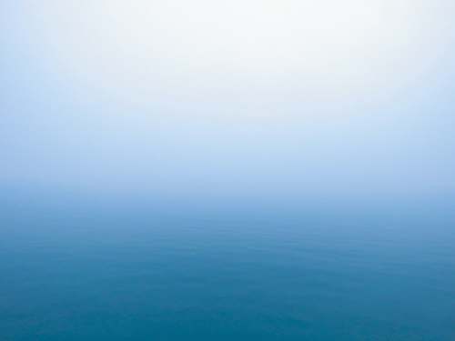 nature ocean water during fog sky