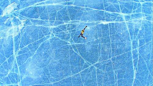 lake person falling on blue surface lake of the isles