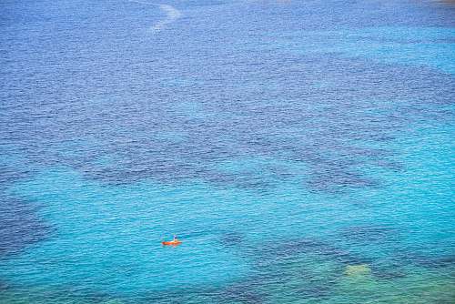 nature person riding on boat during daytime ocean