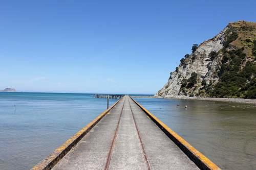 sea photo of grey and brown dock water