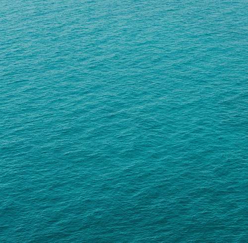 ripple photography of green body of water water
