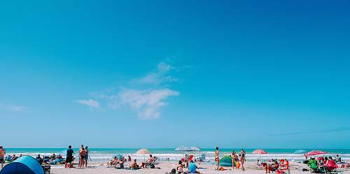 person photography of people gathering beside seashore during daytime human