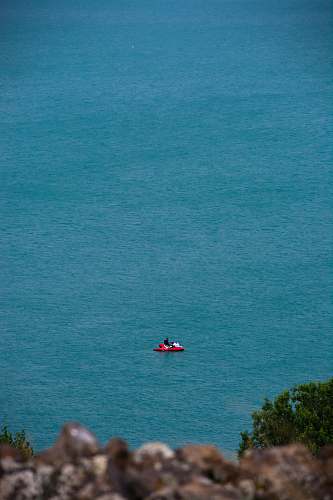 adventure red boat on body of water leisure activities