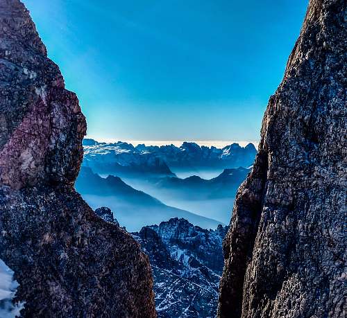 mountain rock mountains with mist in between rock canyon view during daytime cliff