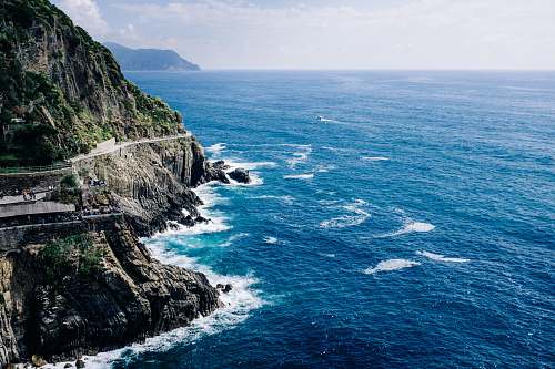 outdoors rocky mountain surrounded by ocean nature photography cliff