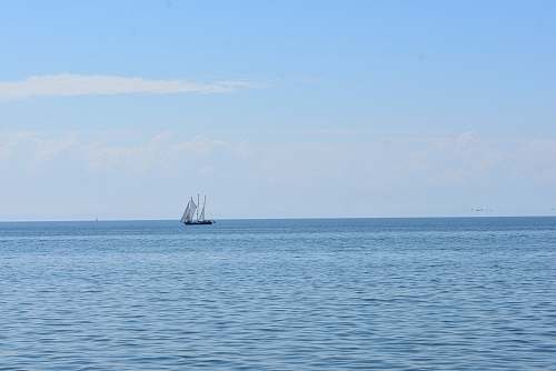 vehicle sailboat on calm body of water transportation
