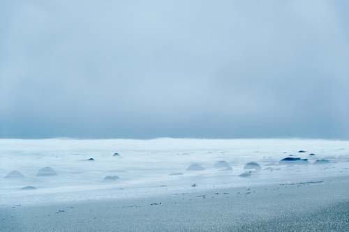 nature sea under cloudy sky outdoors