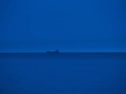 nature ship sailing on the blue sea teal