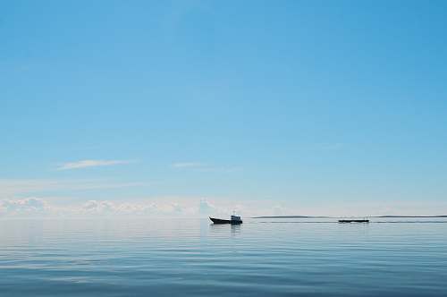 horizon silhouette of boat on the ocean sky