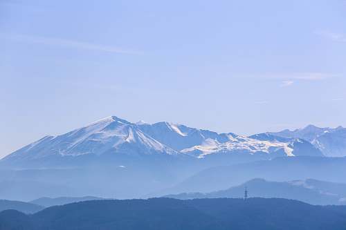 mountain snow capped mountain under clear sky mountain range