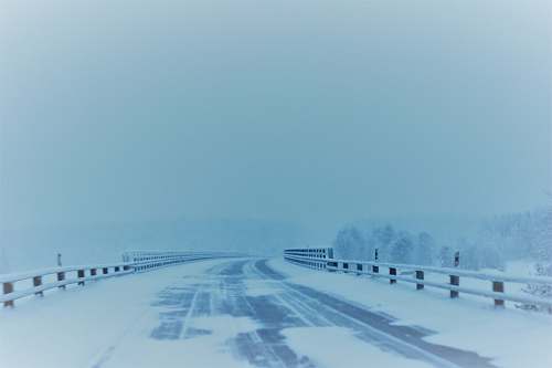 nature snow covered empty road snow