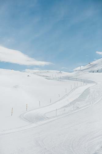 nature snowfield under clear blue sky outdoors