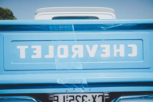 bavans teal Chevrolet pickup truck's tailgate closeup photo france