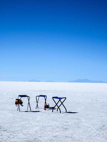 furniture three blue-and-gray folding camping chairs on ground chair