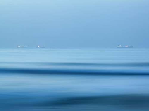 water three boats on body of water ocean