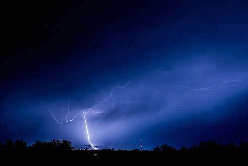 lightning thunder light strike on forest thunderstorm