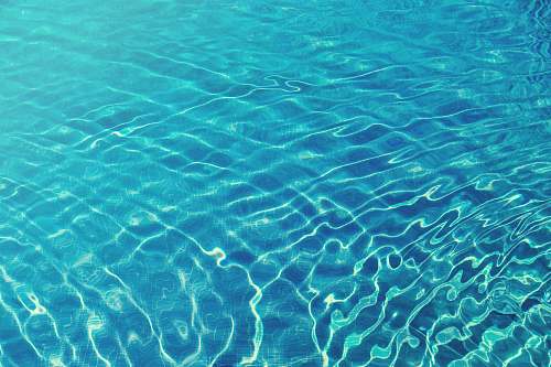 water time lapse photography of blue body of water pool