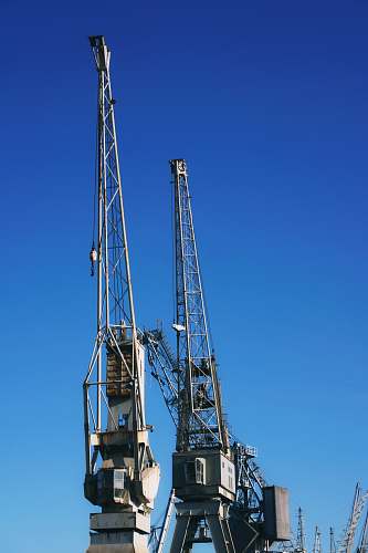 architecture two gray metal cranes construction crane