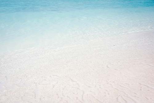 sea wave of water on sea shore sand
