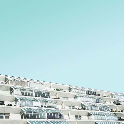 balcony white and brown concrete building at daytime london
