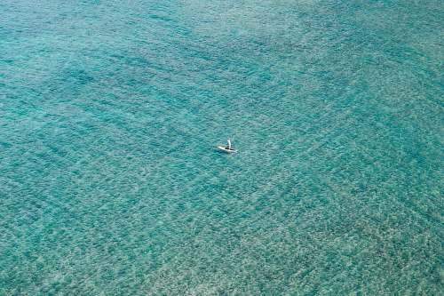 teal white boat sailing on body of water oahu