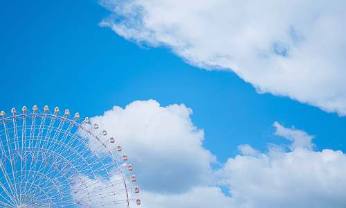nature white ferris wheel during cloudy day sphere