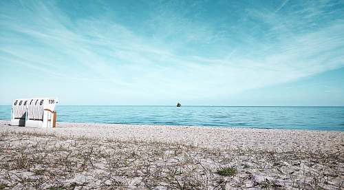 beach white sand near seashore ocean