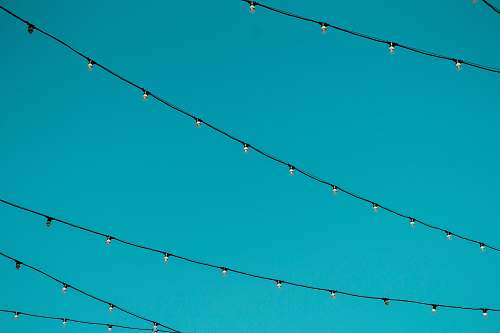 background worm's eye view photography of black string lights lights