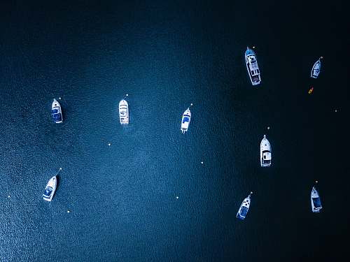 astronomy yachts on body of water during daytime galaxy