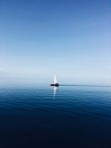 vehicle white sailboat at middle of ocean transportation