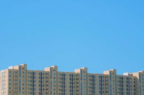 city gray concrete building during daytime high rise