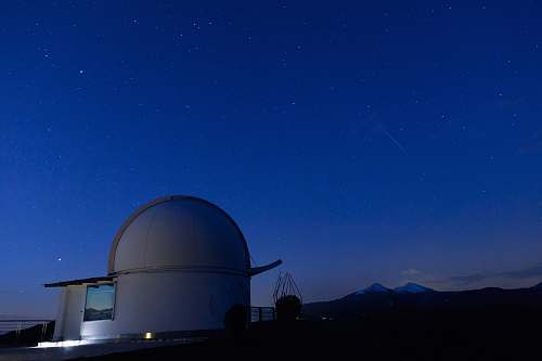 observatory white dome building under blue sky at night stars
