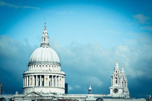 cathedral gray concrete building with black wall clock church