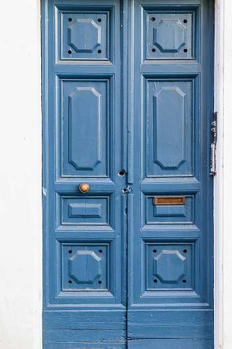 blue brown wooden paneled doors rome