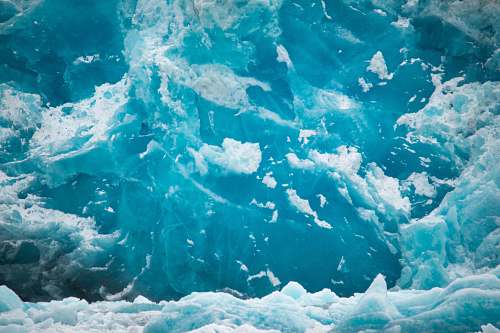 glacier photo of ice and body of water snow