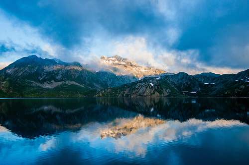 nature parorama photography of mountain under cloudy sky landscape