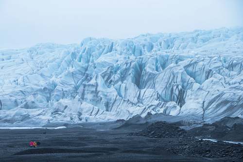 glacier snow capped mountain under white sky during daytime ice