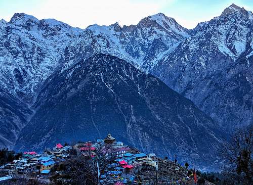 nature village surrounded by mountains outdoors