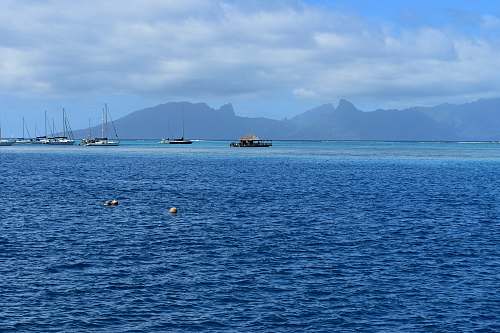 outdoors blue sea under white ksy land