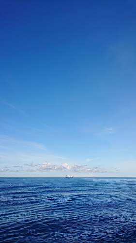 outdoors calm body of water azure sky