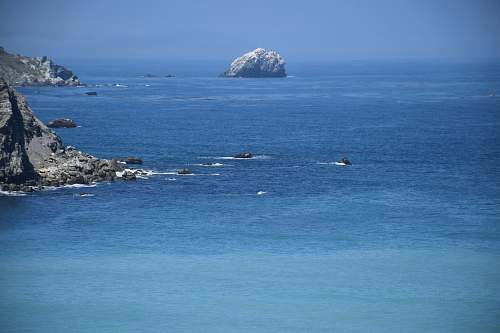 outdoors gray rock on body of water land